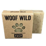 Woof Wild dog shampoo bar in brown kraft packaging with a paw print and label