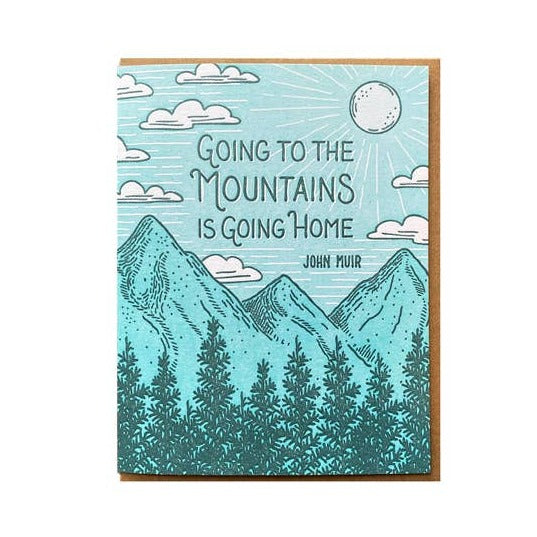 Blue teal mountains greeting card featuring sun, clouds and pine trees with the Going to the Mountains quote