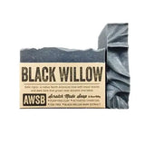Black Willow soap bar in dark gray with a kraft label and wrapped side