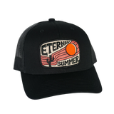 Black curved brim trucker hat with an embroidered retro sunset desert patch showing a sun and cactus
