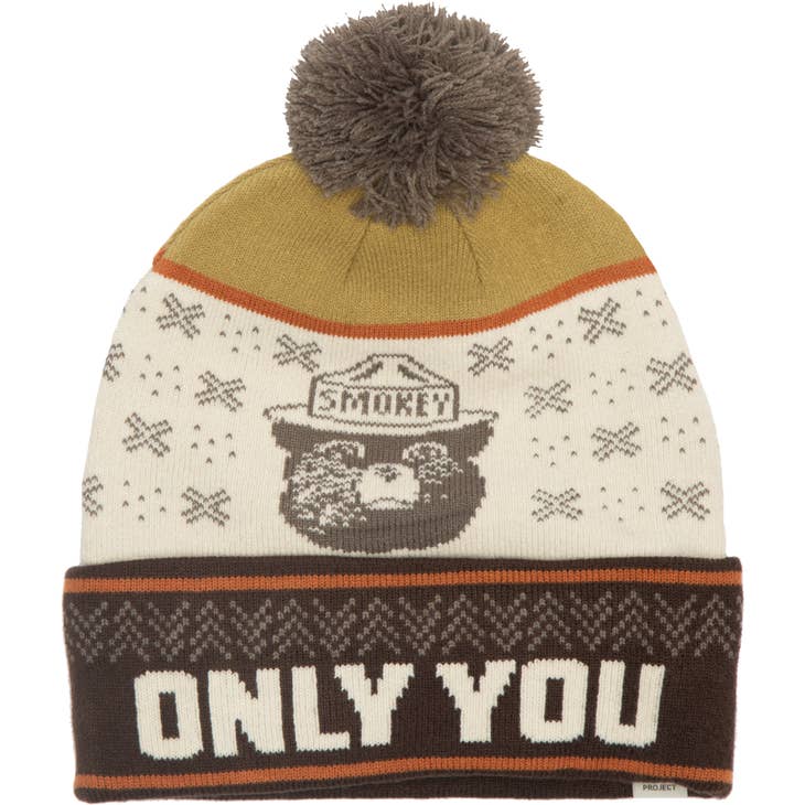 Cream and brown knit beanie with a Smokey Bear graphic and the words ONLY YOU on the cuff