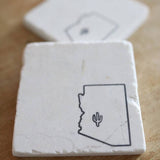 White marble coaster featuring an outline of Arizona with a small cactus icon.