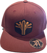Maroon snapback featuring a gold cactus patch with sunburst on the front