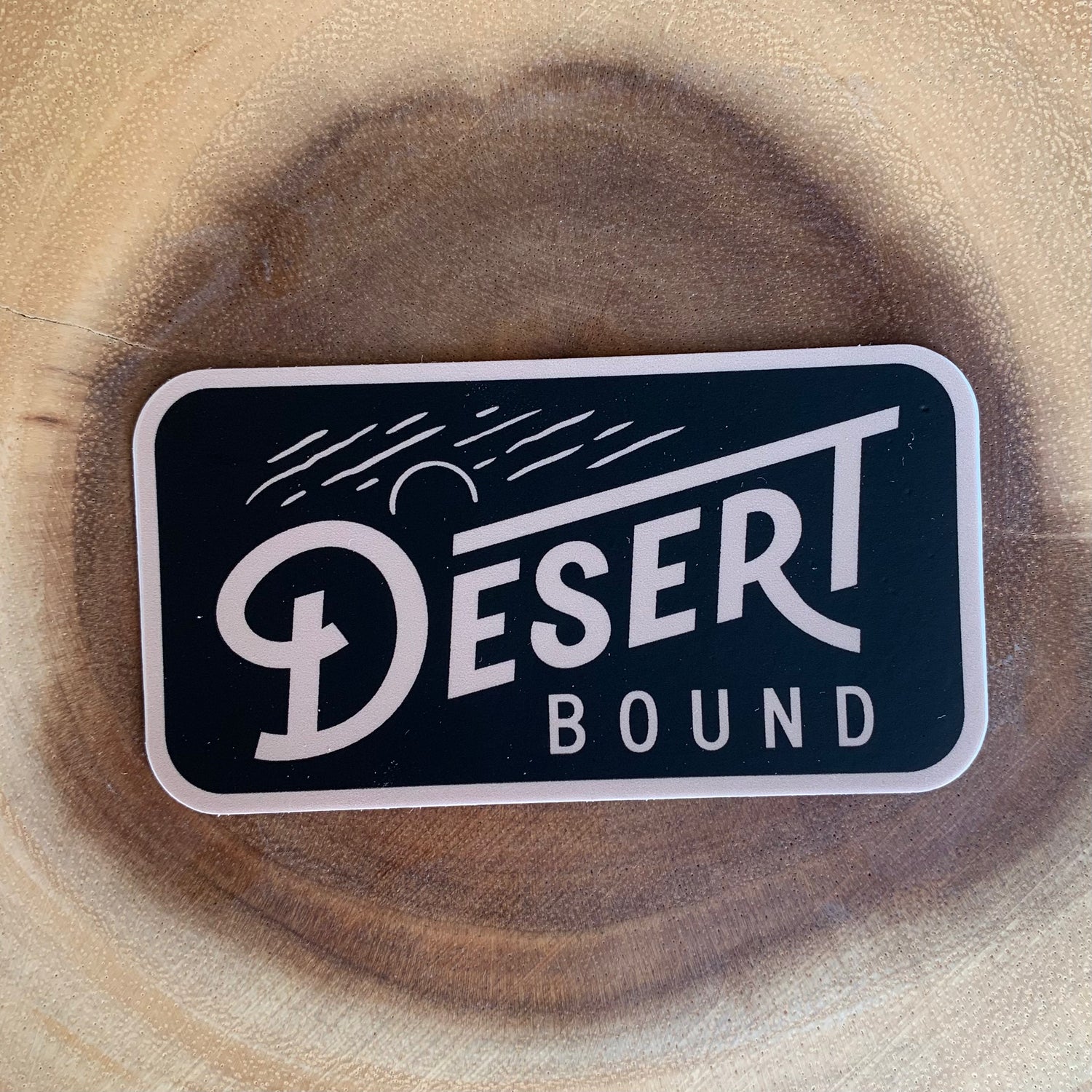 Desert Bound sticker with bold white lettering on a dark blue rounded rectangle background