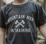 Kids heather gray T shirt featuring Mountain Man in Training and crossed axes graphic.